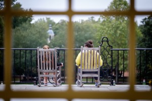 A pair of Wake Forest students relaxes in rocking chairs on the Magnolia Patio on Thursday, October 1, 2015.