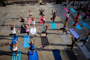 Wake Forest students and staff practice yoga on the Magnolia Patio under the direction of teacher Elliott Watlington on Wednesday, September 30, 2015.