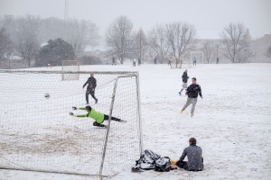 Wake Forest students play soccer on Poteat Field during a snowstorm on Wednesday, January 20, 2016.