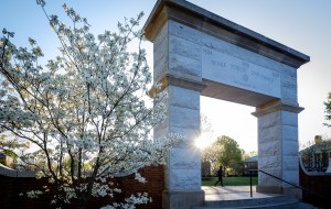A student walks past the arch on Hearn Plaza on the campus of Wake Forest University on Wednesday, April 6, 2016.