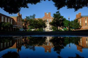 The Z. Smith Reynolds Library is reflected in a puddle on the campus of Wake Forest University on Friday, June 3, 2016.