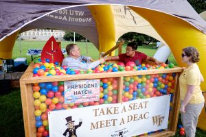 Wake Forest hosts move-in day for first year students at the south campus residence halls on Friday, August 21, 2015.  President Nathan O. Hatch talks with a student in the ball pit on the lower quad.