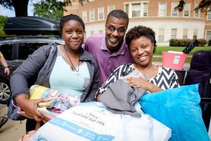 Wake Forest hosts move-in day for first year students at the south campus residence halls on Friday, August 21, 2015.  Sierra Leslie ('19) and her parents, Tosheka and Stephen, pose outside Babcock.